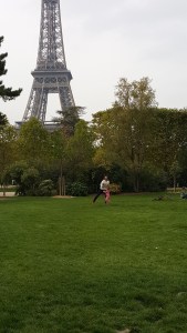 Father - daughter playing in front of Eiffel Tower